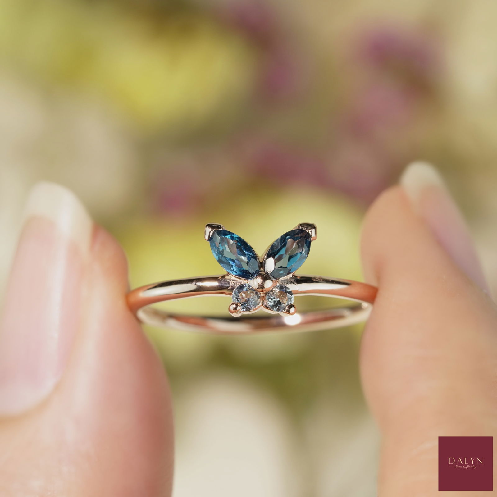 18K Rose Gold Plate Sterling Silver Natural Blue Topaz Butterfly Ring: No Reserve!18K Rose Gold Plate Sterling Silver Natural Blue Topaz Butterfly Ring Stone: Natural Blue Topaz, London Blue Topaz Metal: Gold plated silver 925 Approx. Weight: 1.47 g. Approx. Gemstone Wei