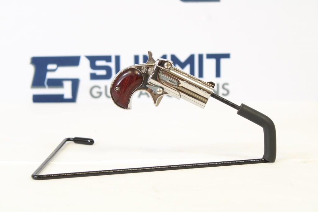 Cobra Enterprises C22M .22 Magnum: This derringer comes with a ramp front sight, has a smooth action, and shows normal signs of usage. Please see photos. - Bore: Shiny , Action: Single - 2