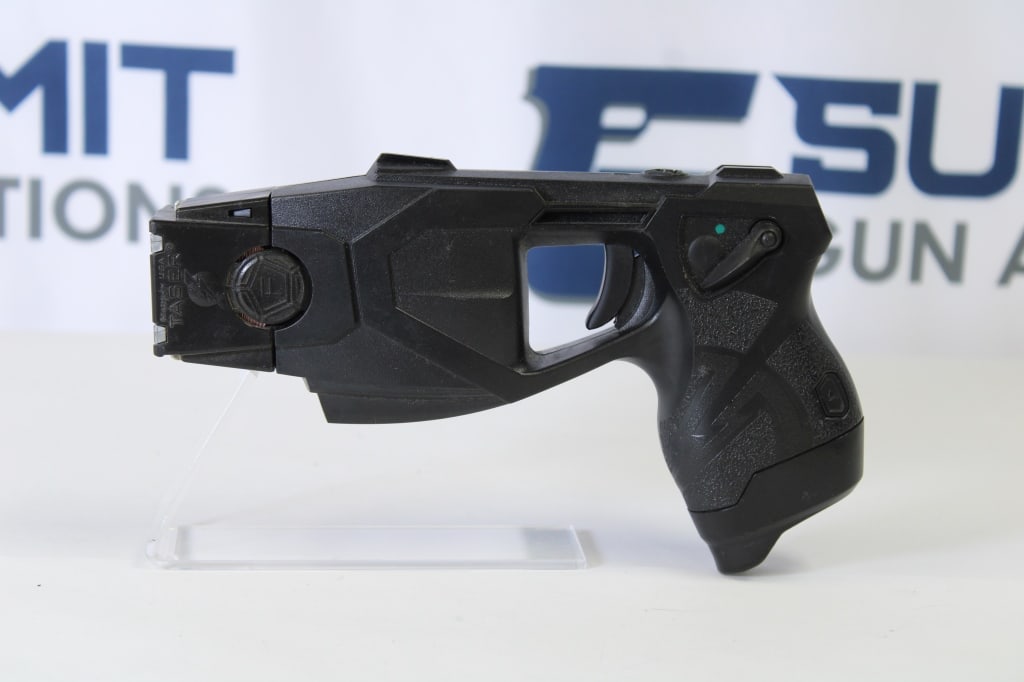Axon X26 Taser: This unique Axon X26 taser is a great non-lethal option. It comes with 1 battery, 1 cartridge. This taser shows normal sign of usage. Please see photos. - Bore: ; Action: ; Length: -