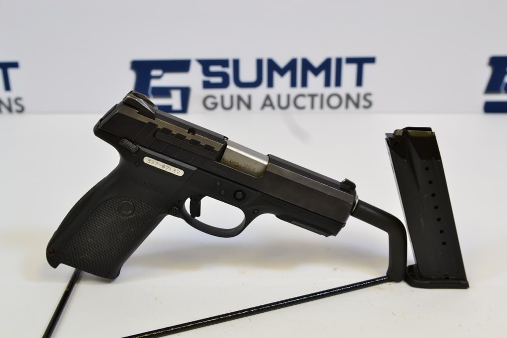 Ruger 9E 9mm: Up for auction is a full-size 9mm pistol. Comes with fixed front and rear sights, selector and trigger safety and (1) magazine. Overall in good condition with normal wear and tear. Please see photos. 