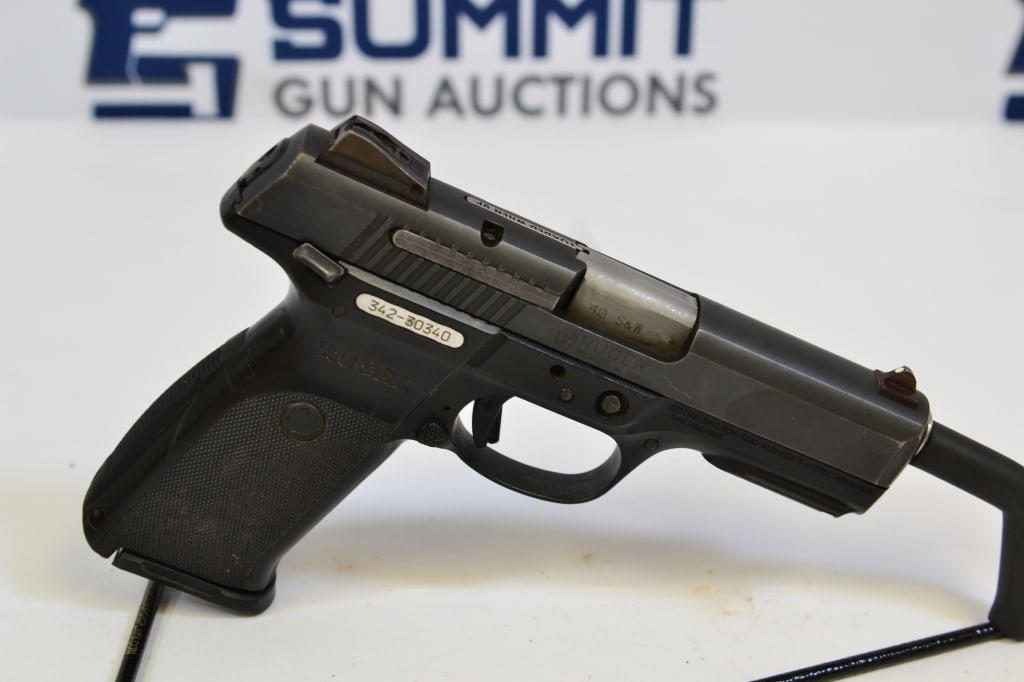 Ruger SR40 .40 S&W: Up for auction is an all black, full size .40 caliber pistol. Comes with fixed front and rear sights. selector and trigger safety, extended grip and (1) magazine. Overall in good condition. Please see
