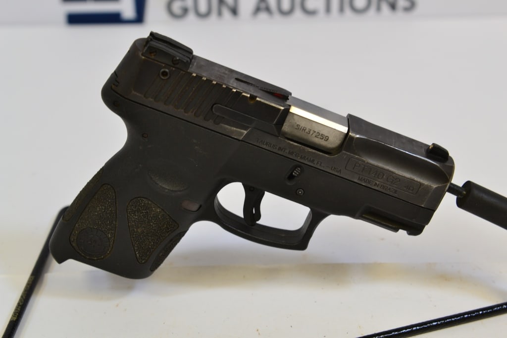 Taurus PT140 G2 .40 S&W: Up for auction is a .40 S&W Brazilian-made pistol. This comes with fixed front and adjustable rear sights, trigger and selector safety, frame rail mount and no magazine. Overall in good condition. Ple