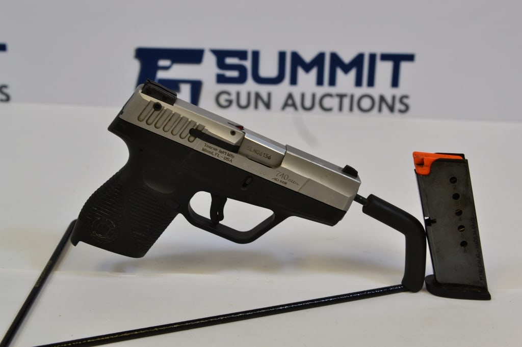 Taurus 740 Slim .40 S&W: Up for auction is a two-toned .40 S&W slim pistol that comes with fixed front sights and adjustable rear sights, trigger safety, and one magazine. Please see photos. ; Barrel Length: 3.25 ; Bore: Shin