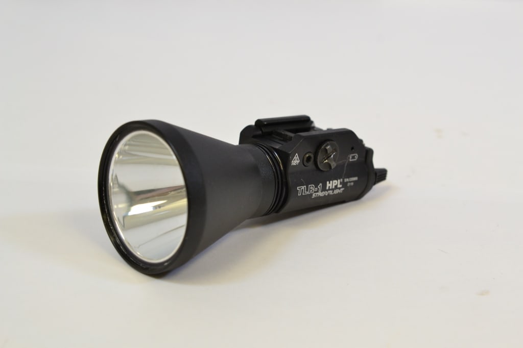 Streamlight TLR-1 HPL: Up for auction is a Streamlight TLR-1 HPL tactical light. It shows signs of wear and usage. Please see photos. ; Barrel Length: ; Bore: ; Action: ; SN#