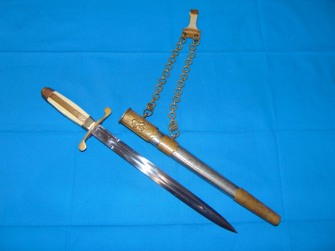 Bulgarian Officers Dress Dagger: BUNGARIAN OFFICER'S DRESS DAGGER WITH CHAIN HANGER. MOUNTS SHOW SOME OXIDATION AND SPOTTING TO THE SURFACES. THE BLADE IS MINTY BRIGHT.