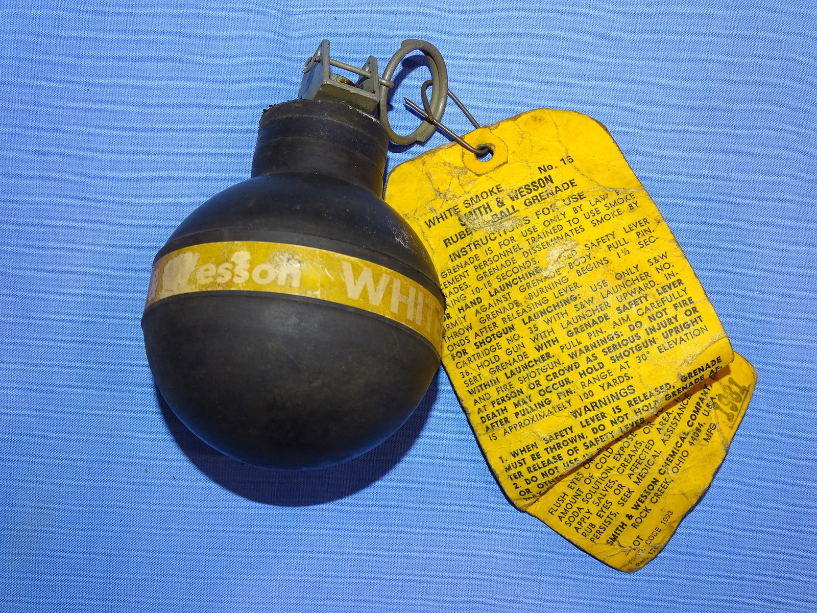 Inert / Dewat 1980's Smith & Wesson S&W Rubber White Smoke Grenade: 1980's ERA S&W RUBBER WHITE SMOKE GRENADE WITH THE ORIGINAL TAG PRESENT. INERT & DEWAT. WILL NOT SHIP OUTSIDE THE U.S., NO EXCEPTIONS!