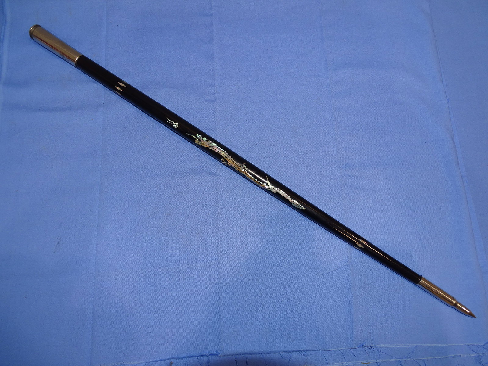 Korean War Era Swagger Stick w/ Mother of Pearl Inlay Dragon: NICE KOREAN WAR ERA SWAGGER STICK, SOME MINOR LOSSES. HAS .50 CAL CASING AT THE TOP AND .30 CAL AT THE BOTTOM.