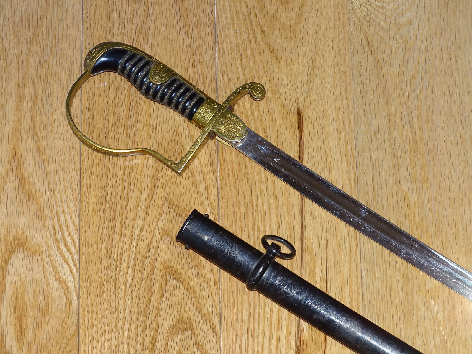WWII German Third Reich Nazi Heer Army Officer's Sword, Dove Head Eickhorn: NICE CLEAN WWII GERMAN ARMY OFFICER'S SWORD. DOVE HEAD POMMEL, 33 1/4" BRIGHT PLATED BLADE, MAKER MARKED TO EICKHORN. A NICE SWORD.