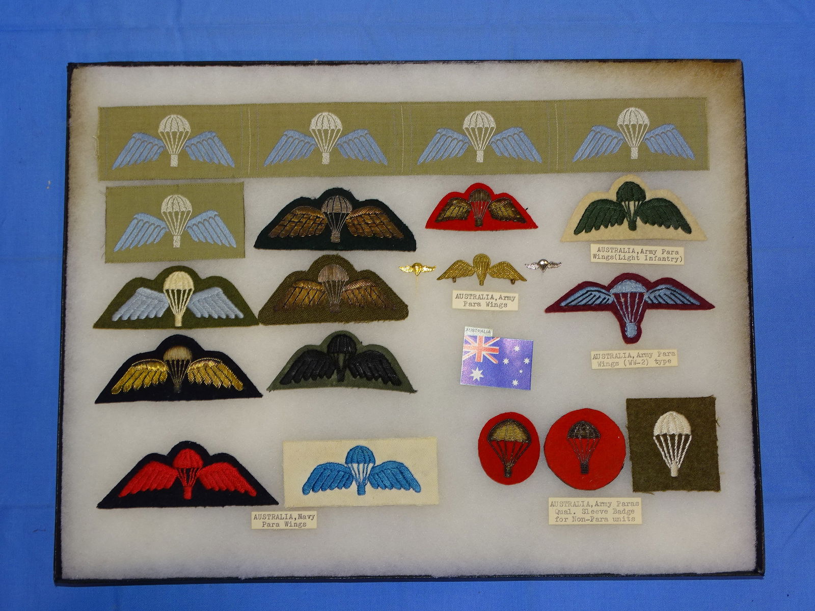 Airborne Paratrooper Wings, Patch Insignia Lot, AUSTRALIA: LARGE COLLECTION OF AIRBORNE PARATROOPER INSIGNIA, YOU WILL RECEIVE THE EXACT ITEMS SHOWN IN THE CASE, INCLUDING THE DESCRIPTIONS. THE RIKER MOUNT CASE IS NOT INCLUDED.