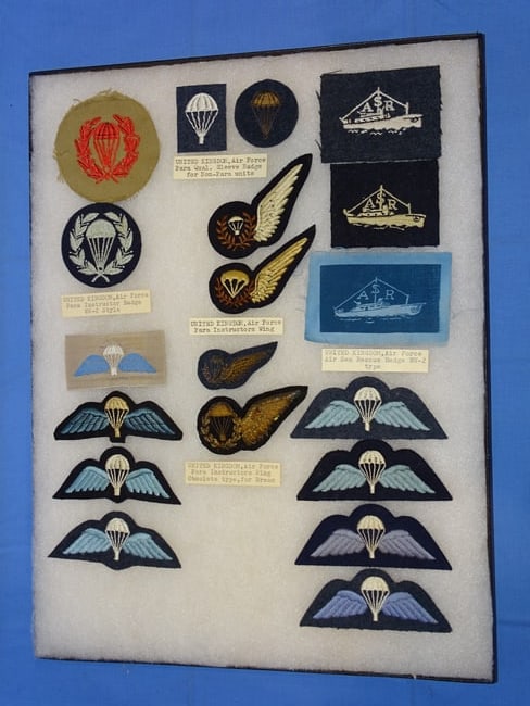 Airborne Paratrooper Wings, Patch Insignia Lot, UNITED KINGDOM: LARGE COLLECTION OF AIRBORNE PARATROOPER INSIGNIA, YOU WILL RECEIVE THE EXACT ITEMS SHOWN IN THE CASE, INCLUDING THE DESCRIPTIONS. THE RIKER MOUNT CASE IS NOT INCLUDED.