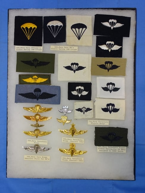 Airborne Paratrooper Special Forces Wings, Patch Insignia Lot, USN: LARGE COLLECTION OF AIRBORNE PARATROOPER INSIGNIA, YOU WILL RECEIVE THE EXACT ITEMS SHOWN IN THE CASE, INCLUDING THE DESCRIPTIONS. THE RIKER MOUNT CASE IS NOT INCLUDED.