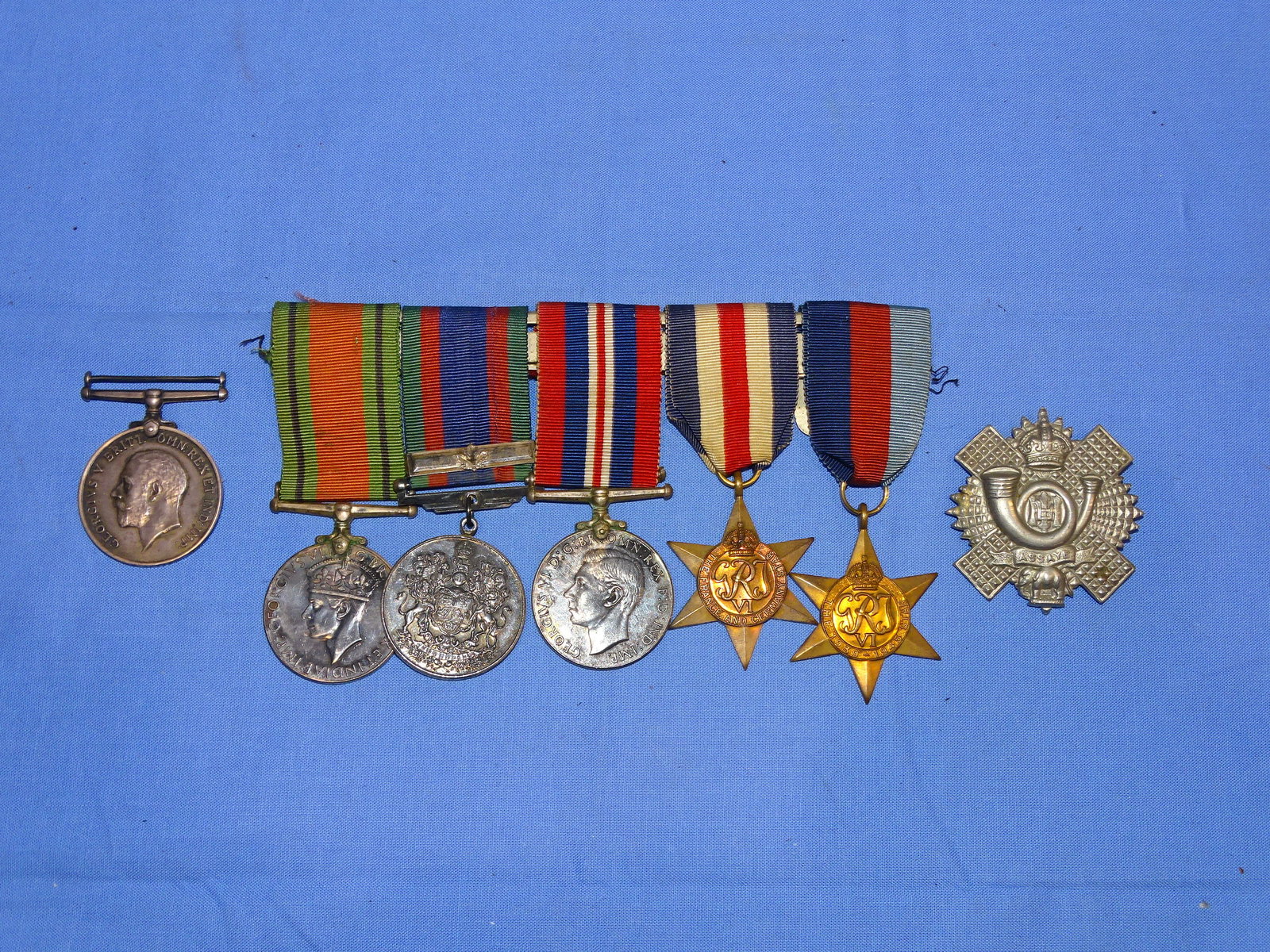 WWI - WWII British / Canadian Medal, Badge Lot: NICE LOT OF BRITISH & CANADIAN MEDALS. THE WWI MEDAL IS NAMED TO THE RIM: 24723 A-SJT.H.E.HATTER.13-CAN.INF.