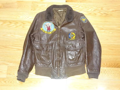 Vietnam War Era USN G-1  Leather Flight Jacket, VR-22 / VR-52 Squadron, 1972 Dated: NICE VIETNAM WAR ERA FLIGHT JACKET, SPEC TAG STILL PRESENT, SIZE 40 AND 1972 DATED. HAS SOME NICE PATCHES INCLUDING A "GRANNY" SQUADRON PATCH. NICE OVERALL CONDITION, SOME WEAR TO THE CUFFS AS WOULD B