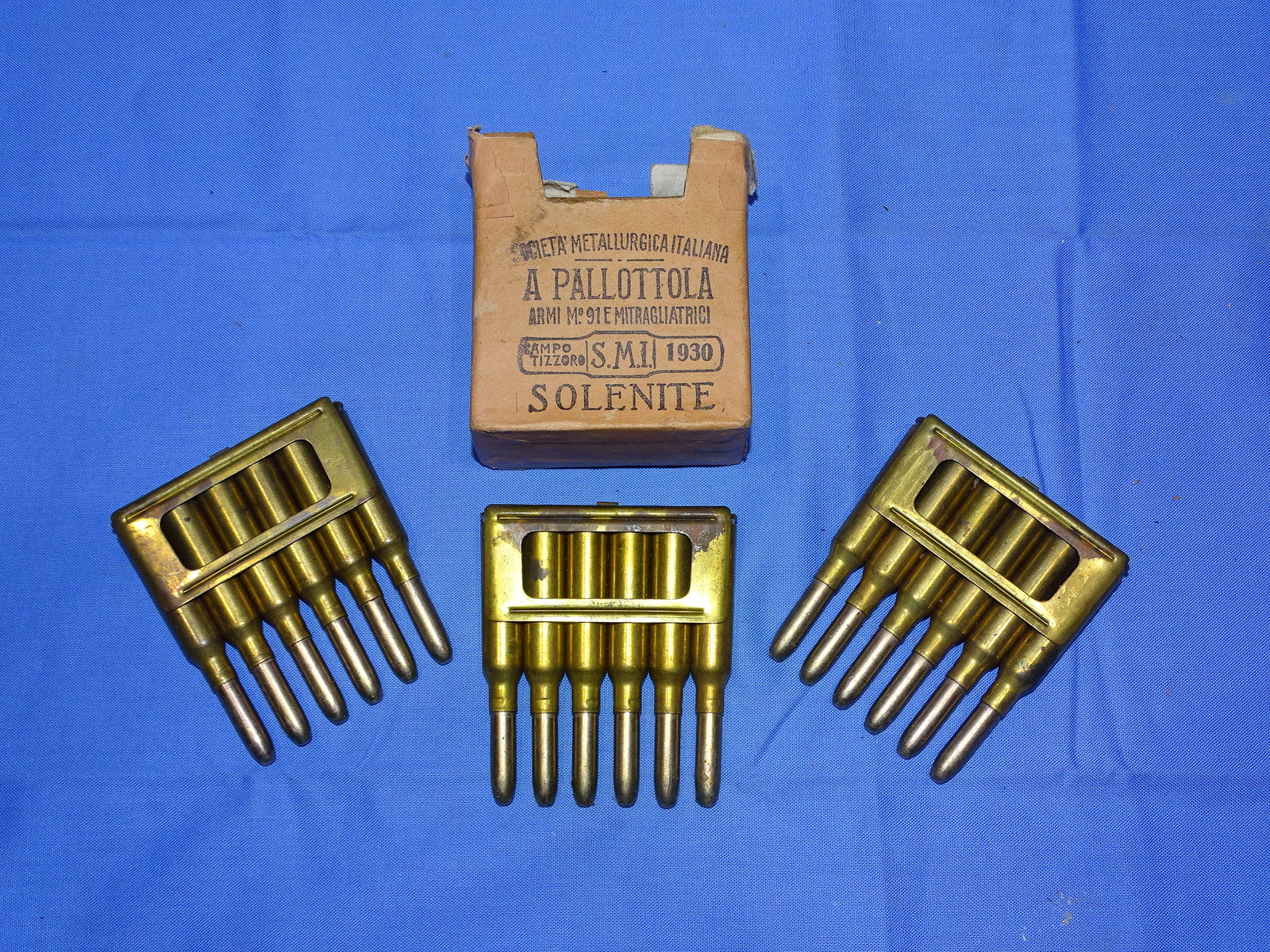 Pre-WWII 1930 Italian Carcano 6.5mm Ammunition, A PALLOTTOLA: NICE OPENED BOX OF 1930 DATED ITALIAN 6.5mm CARACANO AMMO, 3 CLIPS, 18 ROUNDS TOTAL. WILL NOT SHIP OUTSIDE THE U.S. We will not ship to Alaska, Hawaii, Massachusetts, California, New York, Washington 