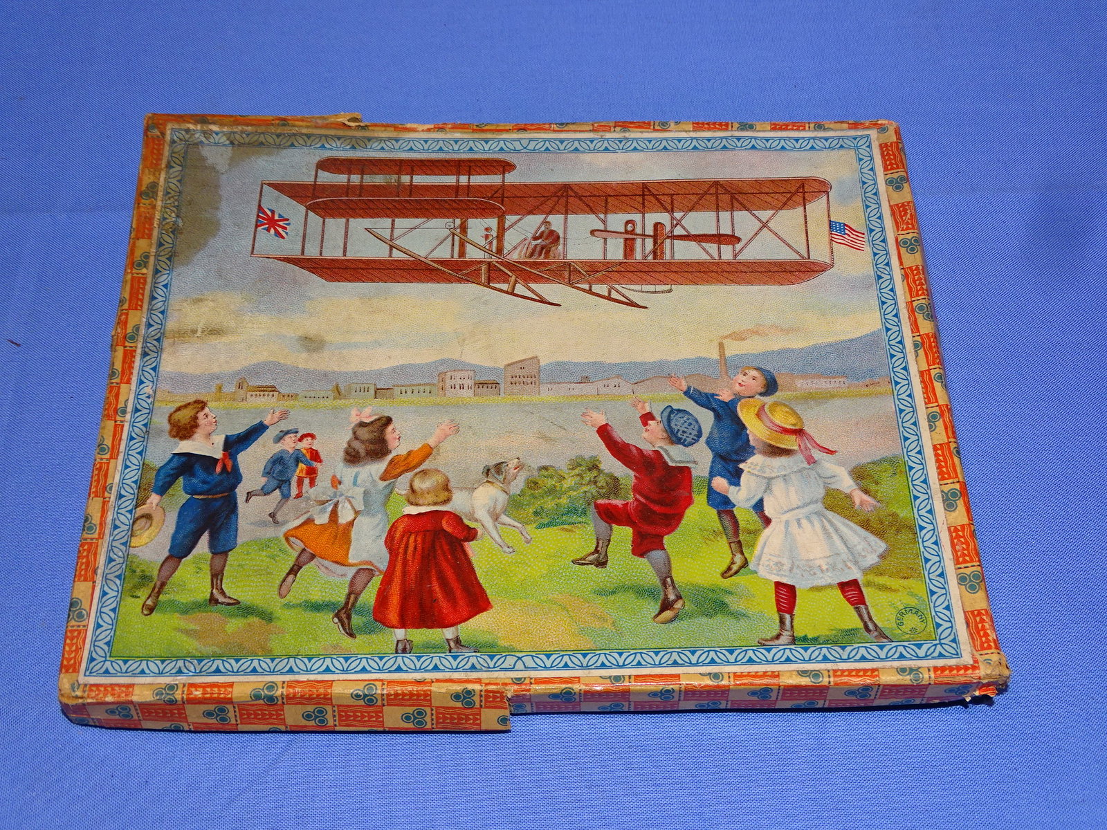 Vintage Wooden Litho 2 Sided Block Puzzle, WRIGHT BROS & DIRIGIBLE w/ Box: NICE DOUBLE SIDED WOODEN BLOCK PUZZLE WITH THE ORIGINAL BOX. ONE SIDE LOOKS TO SHOW THE WRIGHT BROS AEROPLANE IN FLIGHT, THE OTHER SIDE SHOWS A DIRIGIBLE IN FLIGHT. SOME WEAR TO THE BOX.