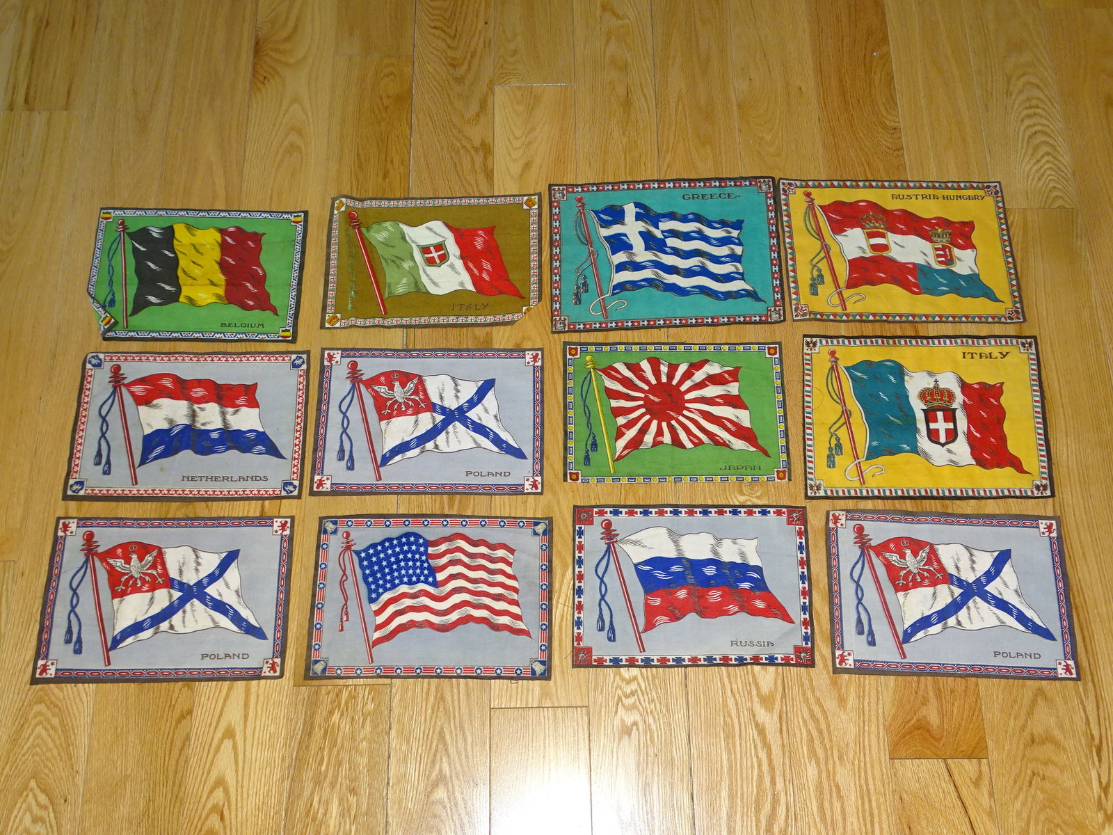 C.1900 Antique Tobacco Felt Lot of 12, Flags of Nations, Larger 8"x12" Size: NICE LOT OF 12 TOBACCO FELTS. FLAGS OF NATIONS. THESE ARE THE LARGER SIZE AND MEASURE APPROX. 8" x 12" EACH