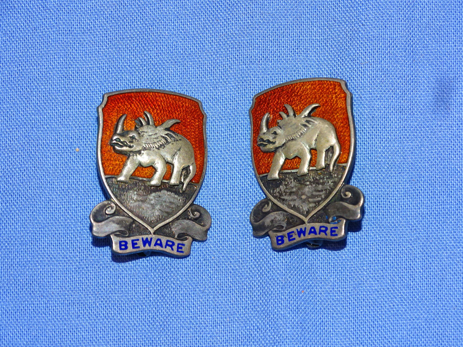 Rare WWII 771st Tank Destroyer Bn "BEWARE" Unit Crest DUI Pair, Sterling Newcomb: RARE WWII UNIT INSIGNIA DUI PAIR FOR THE 771st TANK DESTROYER Bn., STERLING PIN BACK AND NEWCOMB MAKER MARKED. SUPER CONDITION AND ALMOST IMPOSSIBLE TO FIND ORIGINALS.
