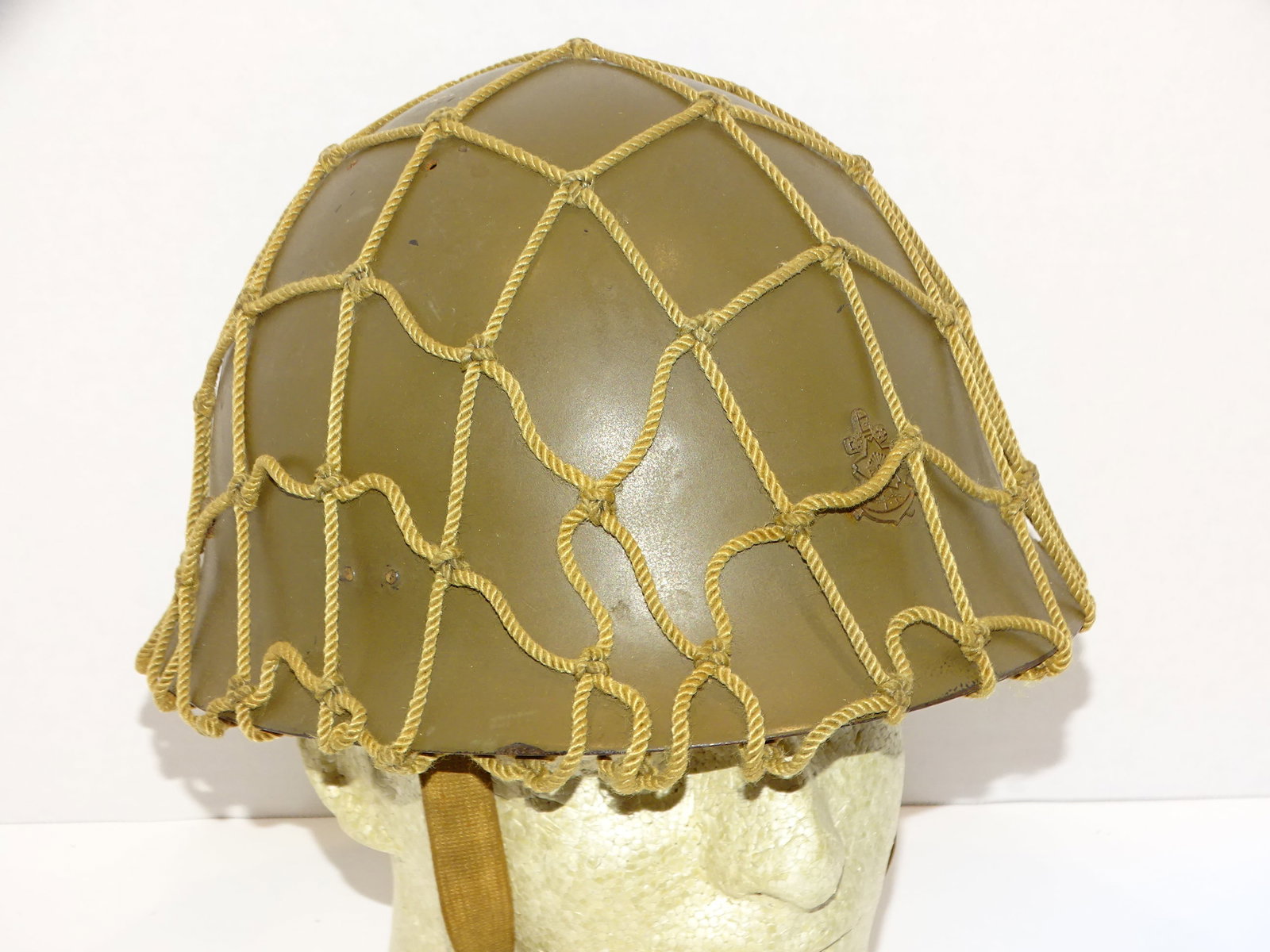 WWII Japanese Navy IJN Combat Helmet w/ Camoflage Net: WWII JAPANESE NAVY HELMET WITH NET COVER, THE INSIDE OF WHICH IS MARKED WITH KANJI. NICE LEATHER LINER IS INTACT, STILL SUPPLE, NOT ALL DRIED OUT. NICE OVERALL CONDITION.