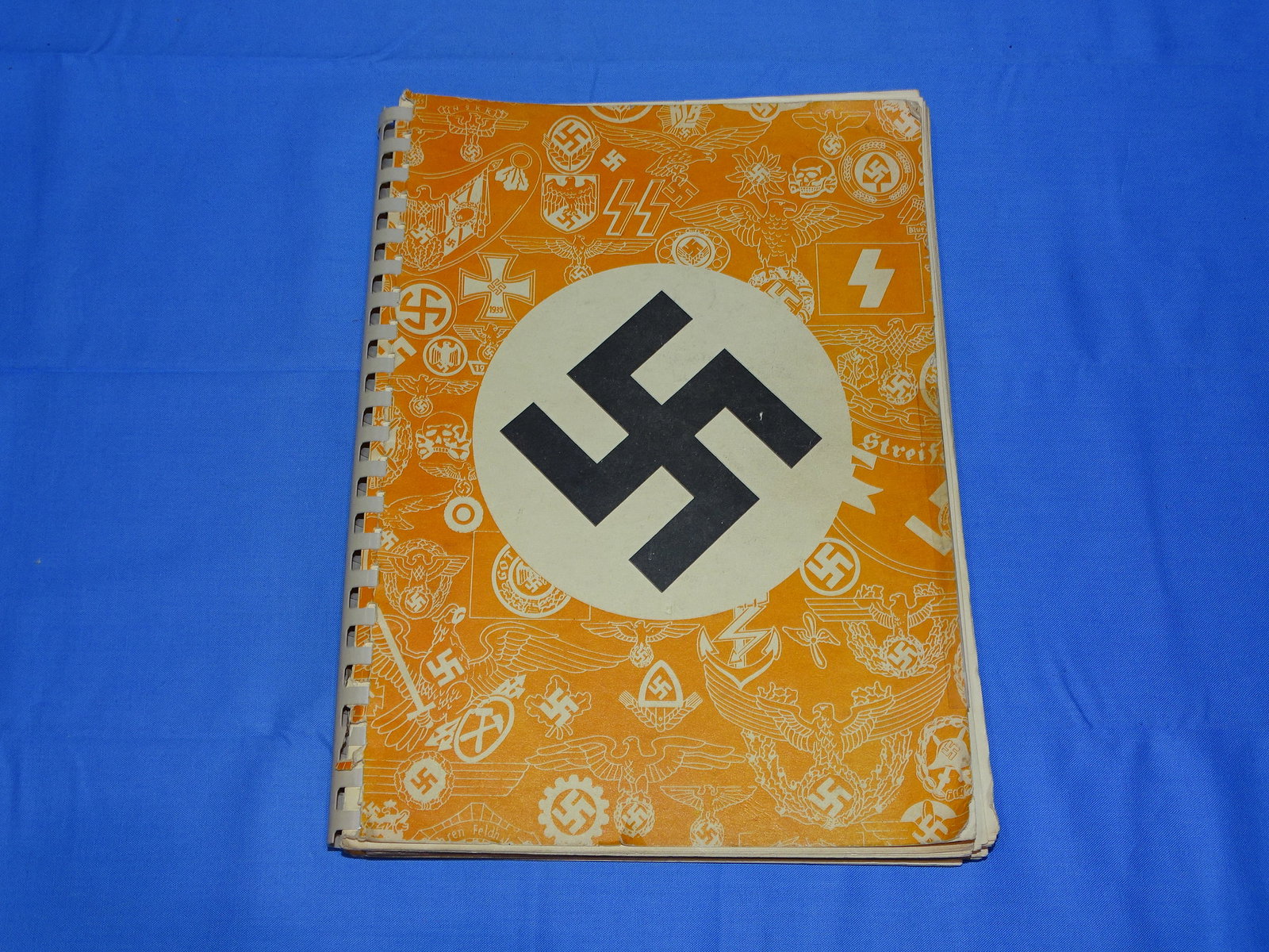 Rare Original WWII German Insignia Catalog, F.W. ASSMANN & SOHNE: RARE ORIGINAL PERIOD COPY OF THE F.W. ASSMANN & SOHNE INSIGNIA CATALOG. A PRICELESS REFERENCE FOR ALL THINGS ASSMANN MADE. SHOWS SOHNS OF USE AND WEAR.