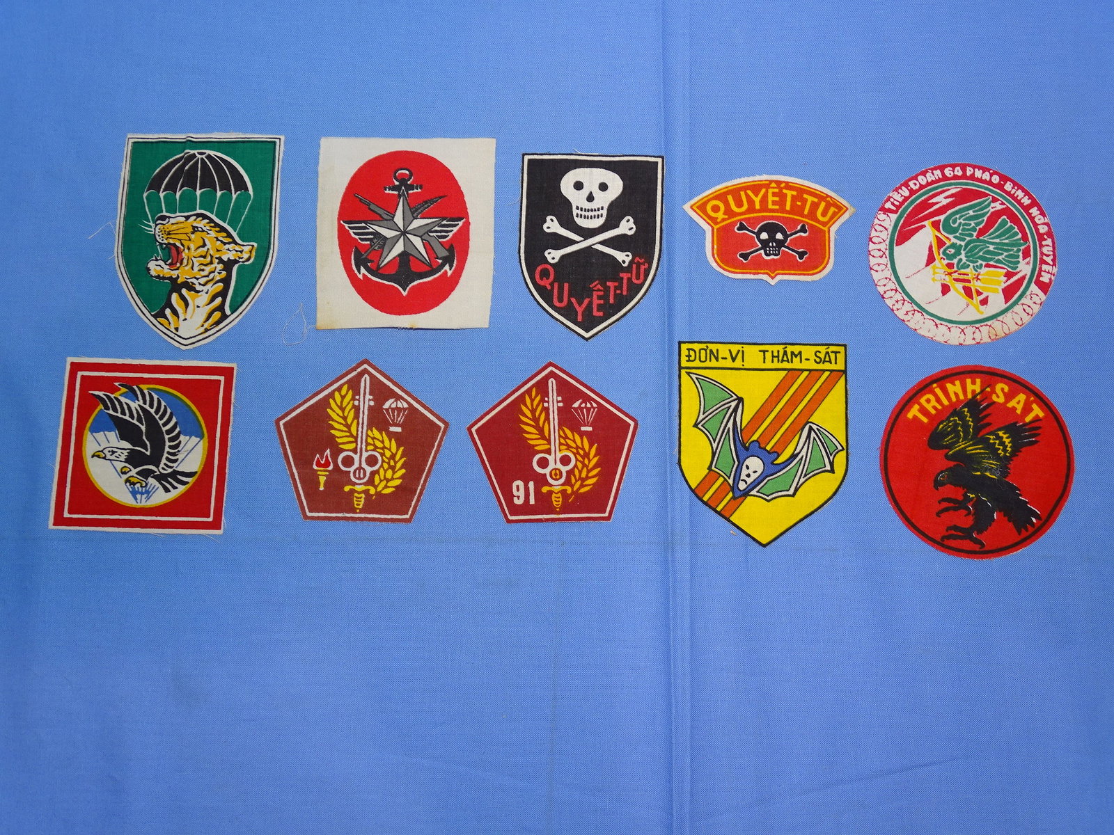 Original Vietnam War Patch Lot: NICE LOT OF 100% ORIGINAL VIERNAM WAR ERA PATCHES, THESE ARE ALL PRINTED ON COTTON, WITH CONTACT PAPER APPLIED TO THE REVERSE, AN OLD COLLECTOR HABIT.
