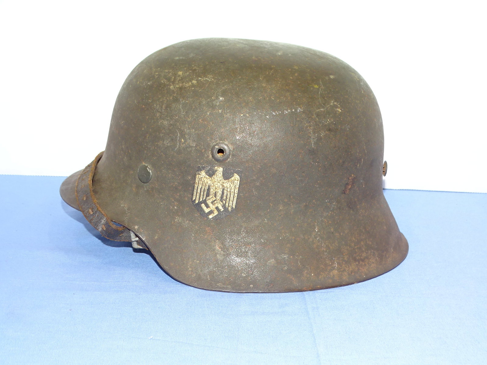 WWII German Nazi Army Heer M42 Single Decal Combat Helmet ET64 Named: NICE HONEST EXAMPLE, WWII GERMAN ARMY SINGLE DECAL COMBAT HELMET. MAKER AND SIZE MARKED, THESHELL AND LINER ARE NAMED TO THE SOLDIER WHO WORE IT.