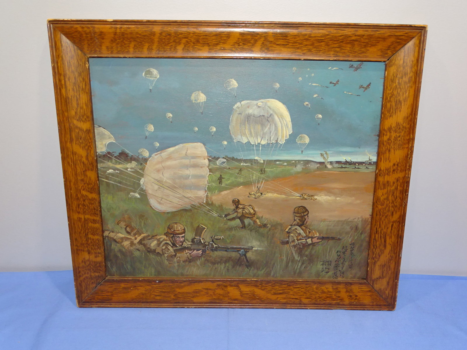 WWII Japanese Painting on Board, Battle of Palembang, Paratroopers, LEONARD FOUJITA: OIL ON BOARD PAINTING, ATTRIBUTED TO OR AFTER LEONARD FOUJITA, OF WHAT IS BELIEVED TO BE JAPANESE PARATROOPERS LANDING ON PALAMBANG. SIGNED LOWER RIGHT WITH KANJI, IT MEASURES APPROX. 16 1/2" x 13 1/2