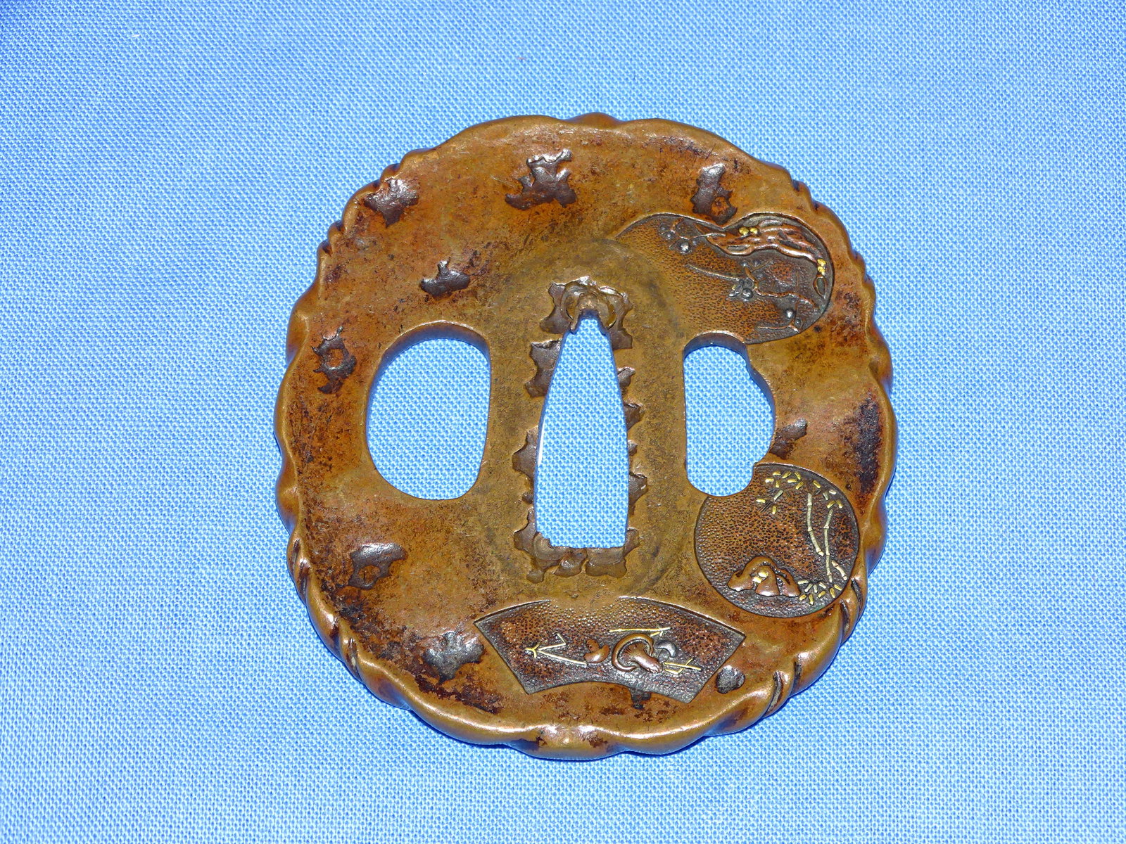 Japanese Samurai Sword Guard TSUBA, Copper w/ Cartouches: JAPANESE SAMURAI SWORD TSUBA, COPPER WITH IMPRESSED CARTOUCHED AND FINE GOLD GILT HIGHLIGHTSAND FANCY RIM.