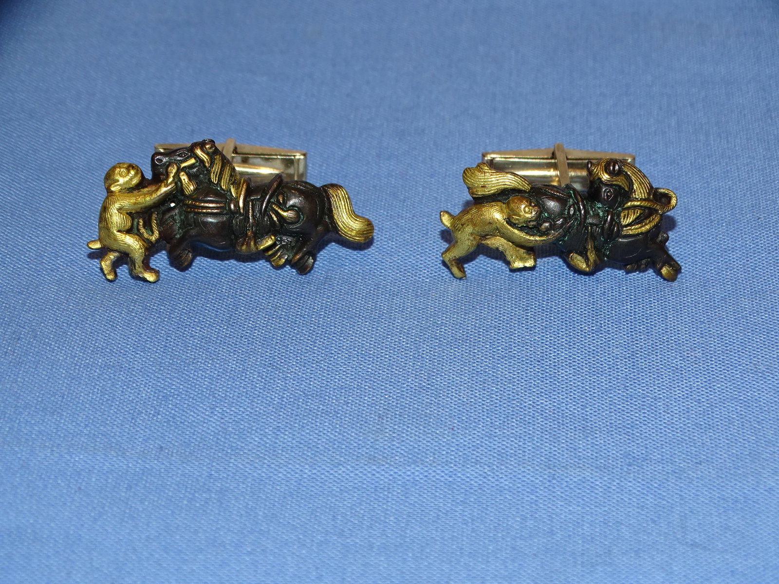 Japanese Samurai Sword Fittings, MENUKI Mounted as Cuff Links, 14K: JAPANESE SAMURAI SWORD MENUKI MOUNTED AS CUFFLINKS, JEWELER MAKER AND 14K MARKED THE OVERALL WEIGHT IS APPROX. 18 GRAMS, AT LEAST HALF OF THAT WEIGHT WOULD BE THE 14K MOUNTS, APPROX. 9 GRAMS (SCRAPS A
