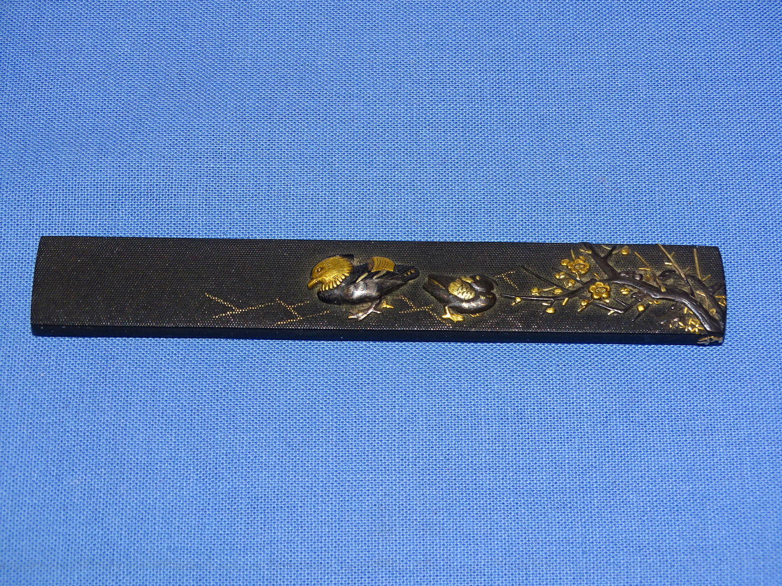 Japanese Samurai Sword Fitting, KOZUKA, Fine Shakudo Nanako, Signed: JAPANESE SAMURAI SWORD FITTING, KOZUKA WITH FINE SHAKUDO NANAKO GROUOND WITH BIRDS OR DUCKS AND PRUNUS. SIGNED TO THE REVERSE.