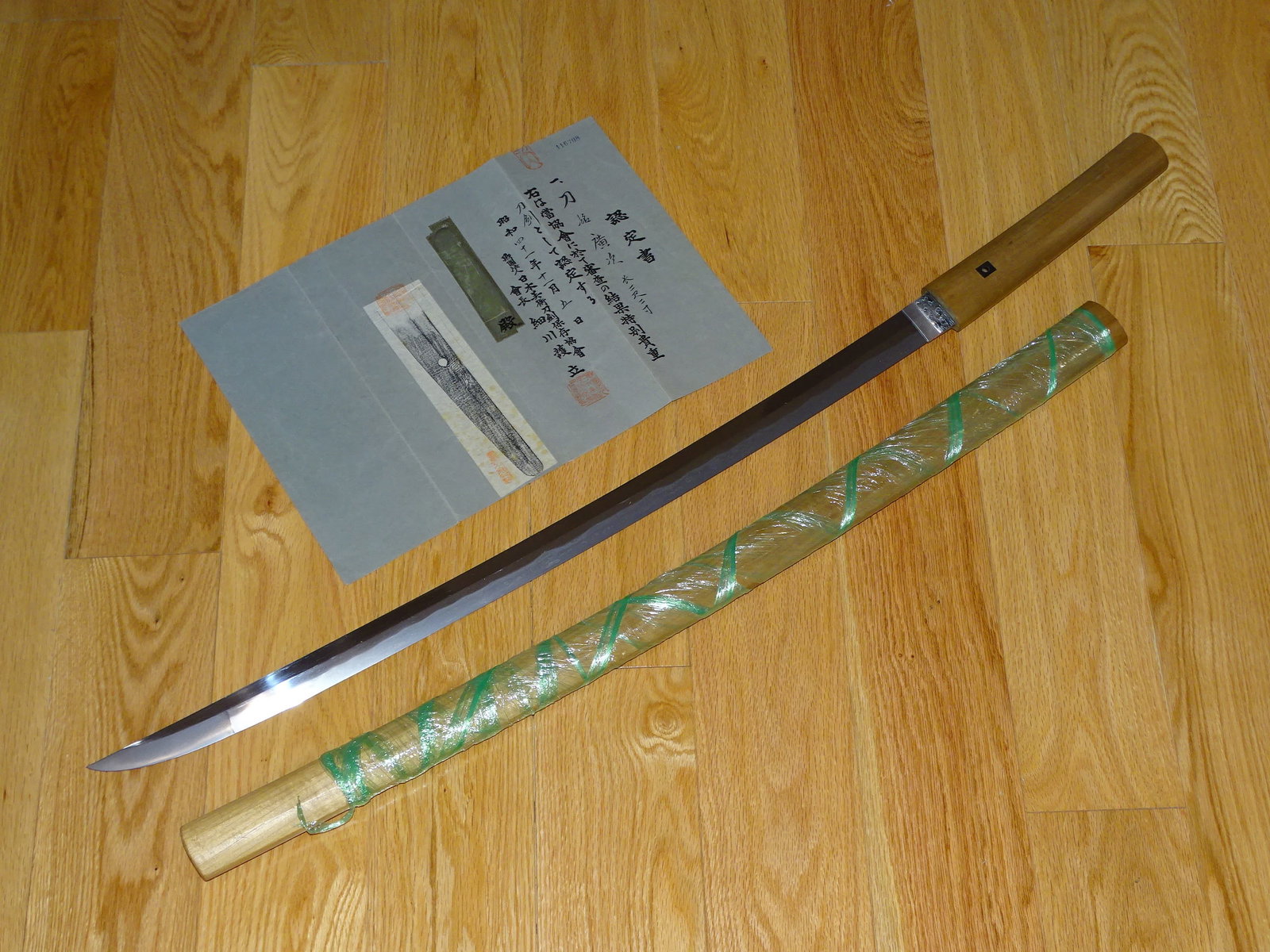 Japanese Samurai Sword, Katana w/ Huge Point, Papered HIROTSUGU: JAPANESE SAMURAI SWORD KATANA IN SHIRA SAYA. BEAUTIFUL BEEFY BLADE WITH A HUGE POINT. THE PIECE IS IN FULL POLISH WITH A VERY NICE 2 PIECE SILVER HABAKI. BEAUTIFUL MIXED ITAME / MOKUME HADA, THE HAMON