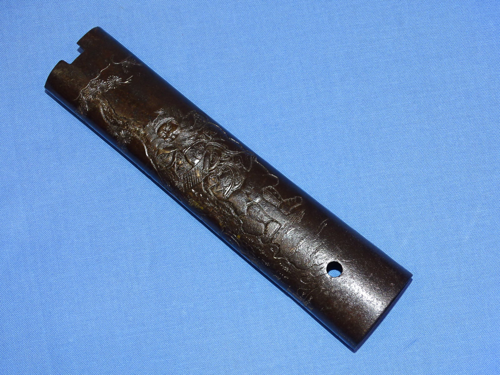 Highly Unusual & RARE Japanese Samurai Sword Hilt TSUKA in IRON: VERY UNUSUAL AND RARELY EVER SEEN, JAPANESE SWORD TSUKA IN IRON ! FOLDED AND BRAZED, IT HAS A SCENE OF A SCHOLAR TO EACH SIDE. IT MEASURES APPROX. 6 3/8" LONG OVERLL, WAKIZASHI SIZED.