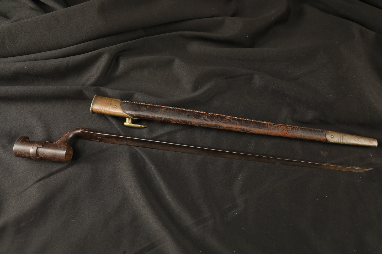 Antique British 1850s 1860s Pattern 1853 Enfield Musket Socket Bayonet & Leather Scabbard: The proper identification of British socket bayonets of the mid-19th century requires true diligence, as the slightest additional markings can determine the difference between a US Civil War import, a