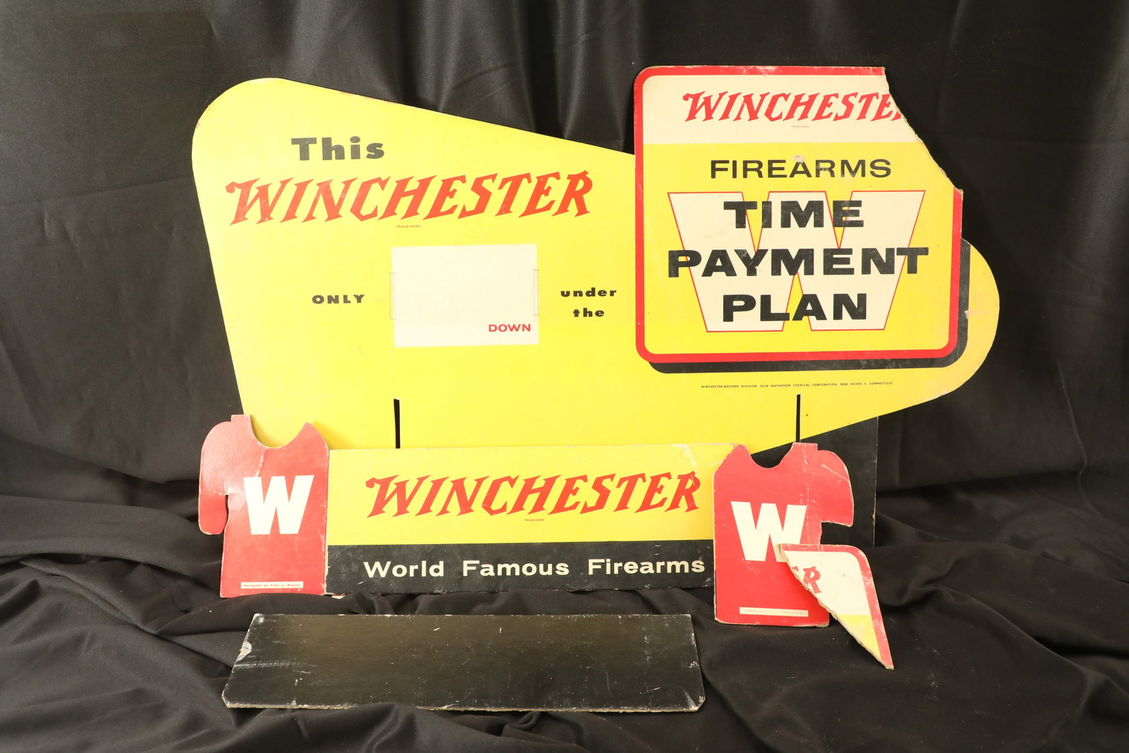 Vintage 50s Winchester W Time Payment Plan Firearms Layaway Program Cardboard Advertising Poster: Winchester has always had clever advertising campaigns and marketing initiatives, and one such program was their “W” time payment plan of the 1950s and 1960s. With a down payment of as little 