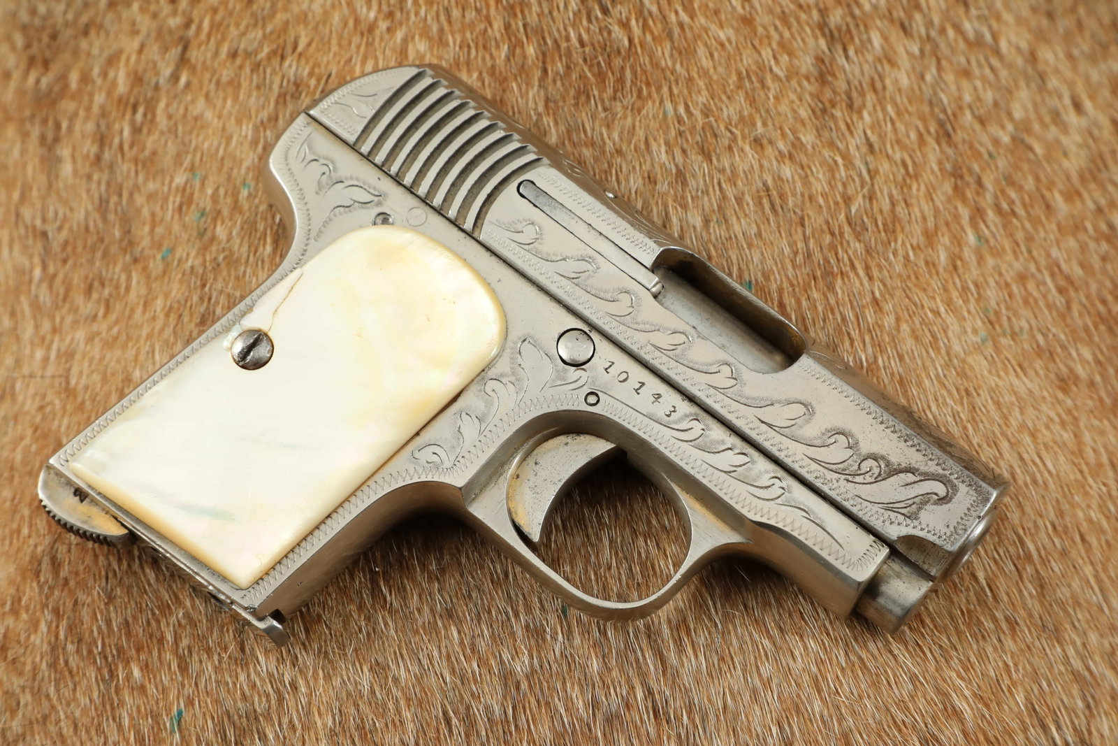 Factory Engraved, Nickel & Pearl Spanish Errasti “Ruby” 7.65mm .32 ACP Pistol: Make: Antonio Errasti, Eibar, Spain Model: “L-ERRASTI”, typically referred to as a “Ruby” Serial Number: 10143 Year of Manufacture: Ca. 1914-1936 Caliber: 7.65mm (.32 ACP) Action Type: