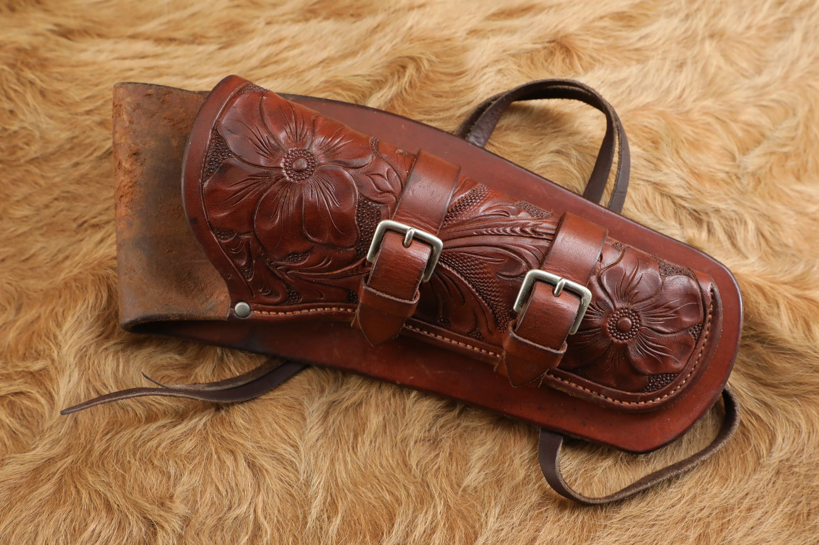 Vintage 1950s H.H. Heiser #754 Colt 5.5" SAA Revolver Tooled Leather "Buscadero" Holster: The expiration of Smith & Wessonâ€™s patent on the bored-through cylinder in 1869 led Colt to design the revolutionary M-1873 Single Action Army, which soon earned the moniker the "Peacemaker"