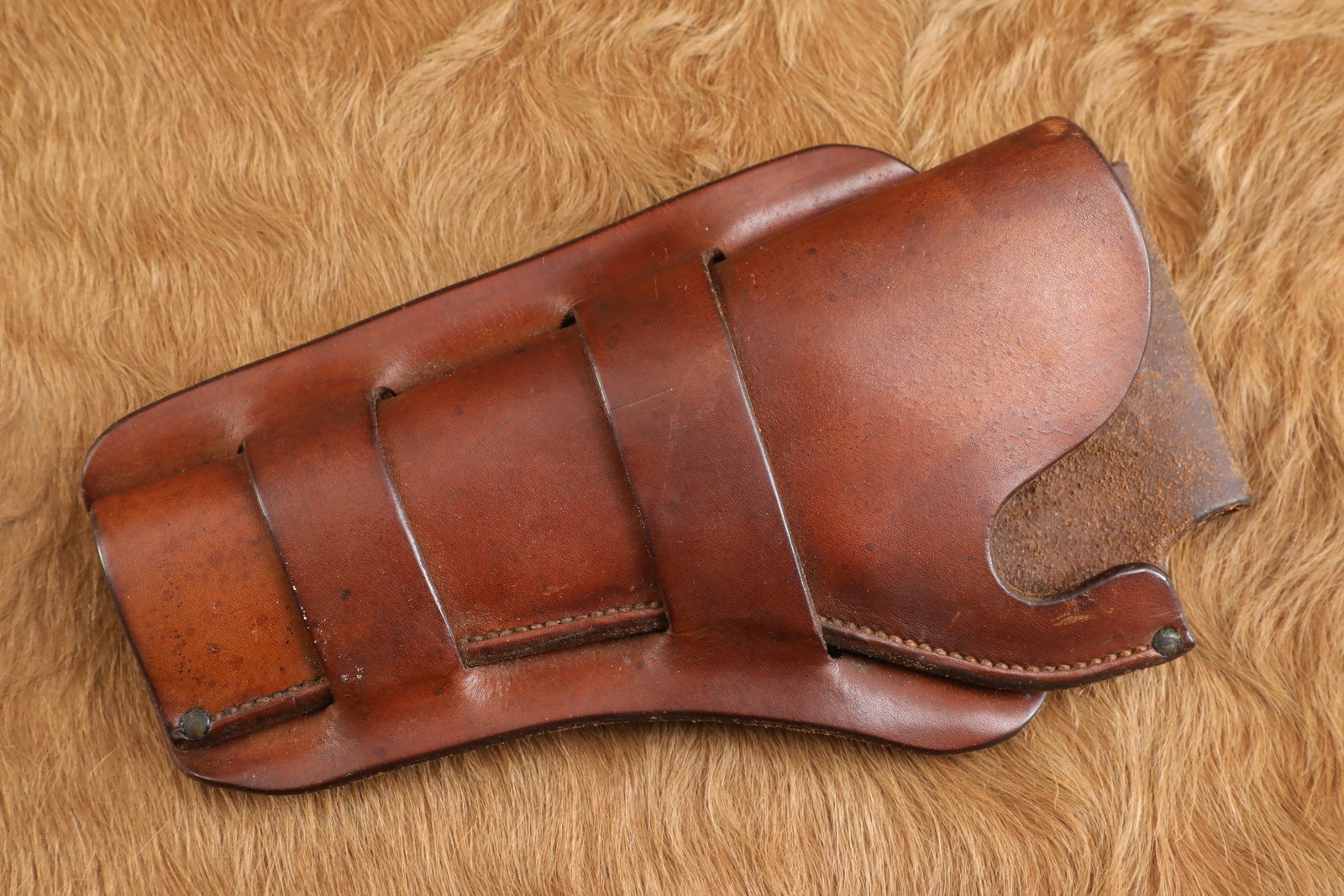 Vintage 1940s H.H. Heiser #410 Colt 5.5" SAA Left Hand "Mexican Double Loop" Leather Pistol Holster: The expiration of Smith & Wessonâ€™s patent on the bored-through cylinder in 1869 led Colt to design the revolutionary M-1873 Single Action Army, which soon earned the moniker the "Peacemaker"