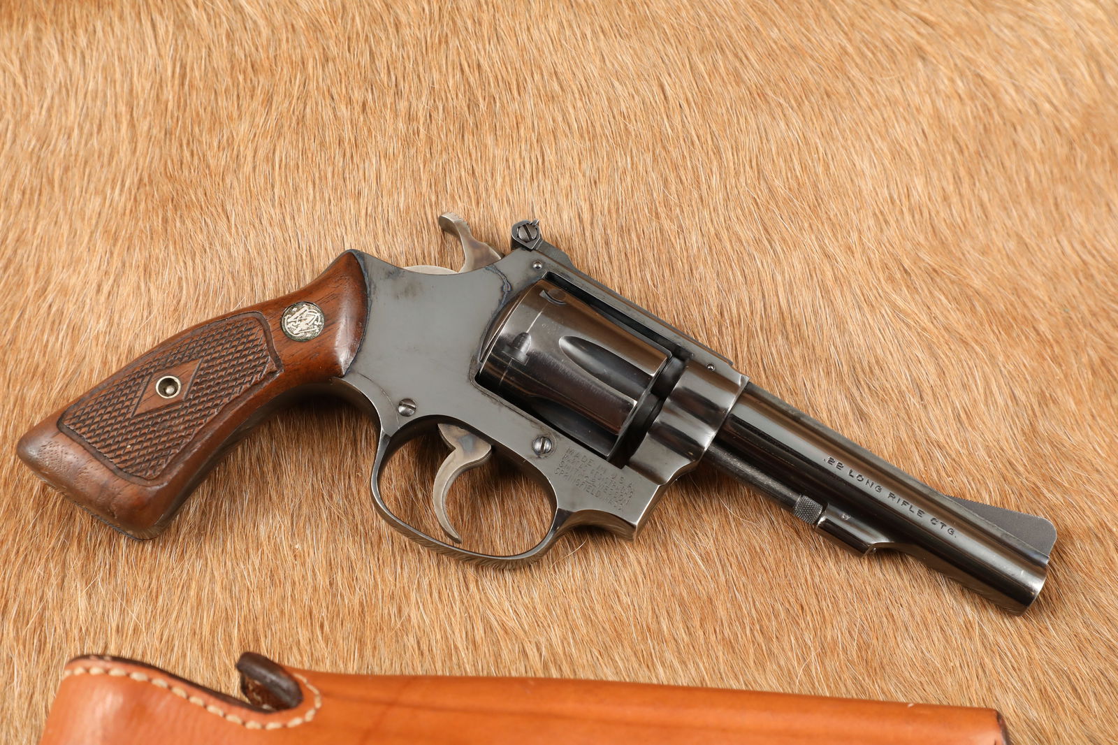 Smith & Wesson Model 34-1 .22 LR 4" Double Action Revolver & Holster, MFD 1969-1970 C&R: Make: Smith & Wesson Model: 34-1 Serial Number: 118873 Year of Manufacture: 1969-1970 (C&R) Caliber: .22 Long Rifle Action Type: Double Action / Single Action Revolver with Swing-Out Cylinder Barrel L