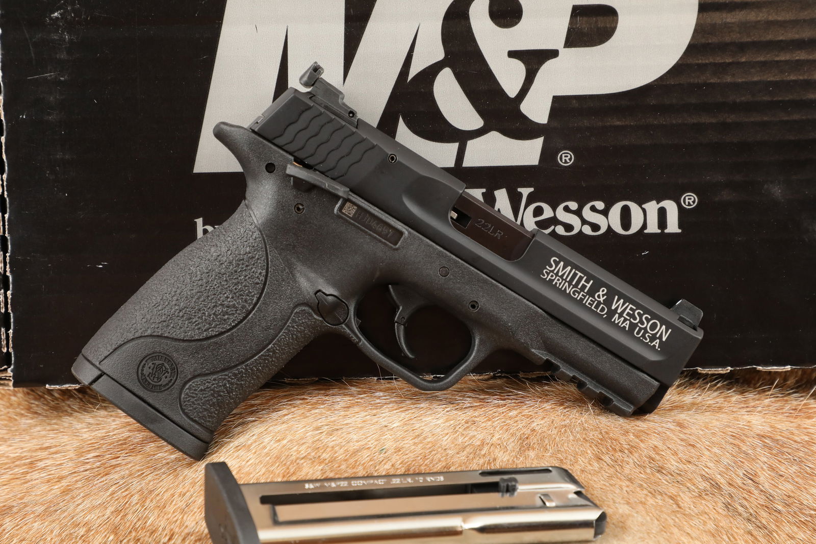 Smith & Wesson S&W M&P 22 Compact 108390 .22 LR Semi-Auto Pistol & Box, MFD 2018: Make: Smith & Wesson Model: M&P22 Compact Serial Number: HJD4697 Year of Manufacture: 2018 Caliber: .22 Long Rifle Action Type: Semi-Automatic, Blowback Operated, Single Action, Detachable Magazine Ba