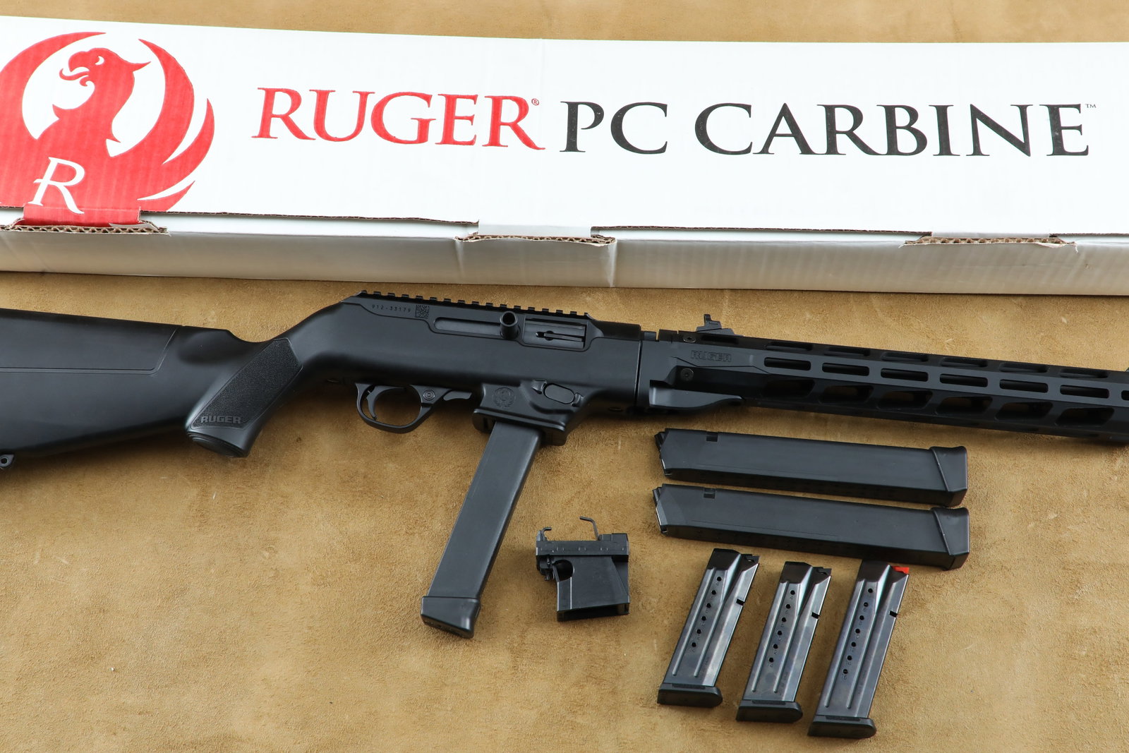 Ruger PC Carbine 9mm Luger 16.12" Takedown Semi-Auto Rifle w/ Glock Magwell & 5 Mags: Make: Ruger Model: PC Carbine (SKU: 19115) Serial Number: 912-33179 Year of Manufacture: Modern Caliber: 9mm Luger Action Type: Semi-Automatic, Blowback-Operated, Takedown Rifle Barrel Length: 16.12",