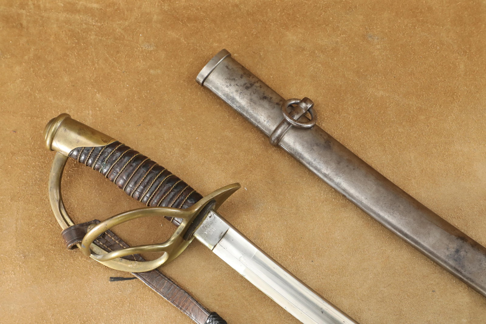 US Union Army Civil War Roby M-1860 Light Cavalry Saber, Sheath and Leather Sword Knot: Very Good Condition. A chip to the blade tip. Some light scratching and pitting to the gleaming 34.75" upswept bright blade. Some light cracking and scuffing to the leather grip. Some light loosening