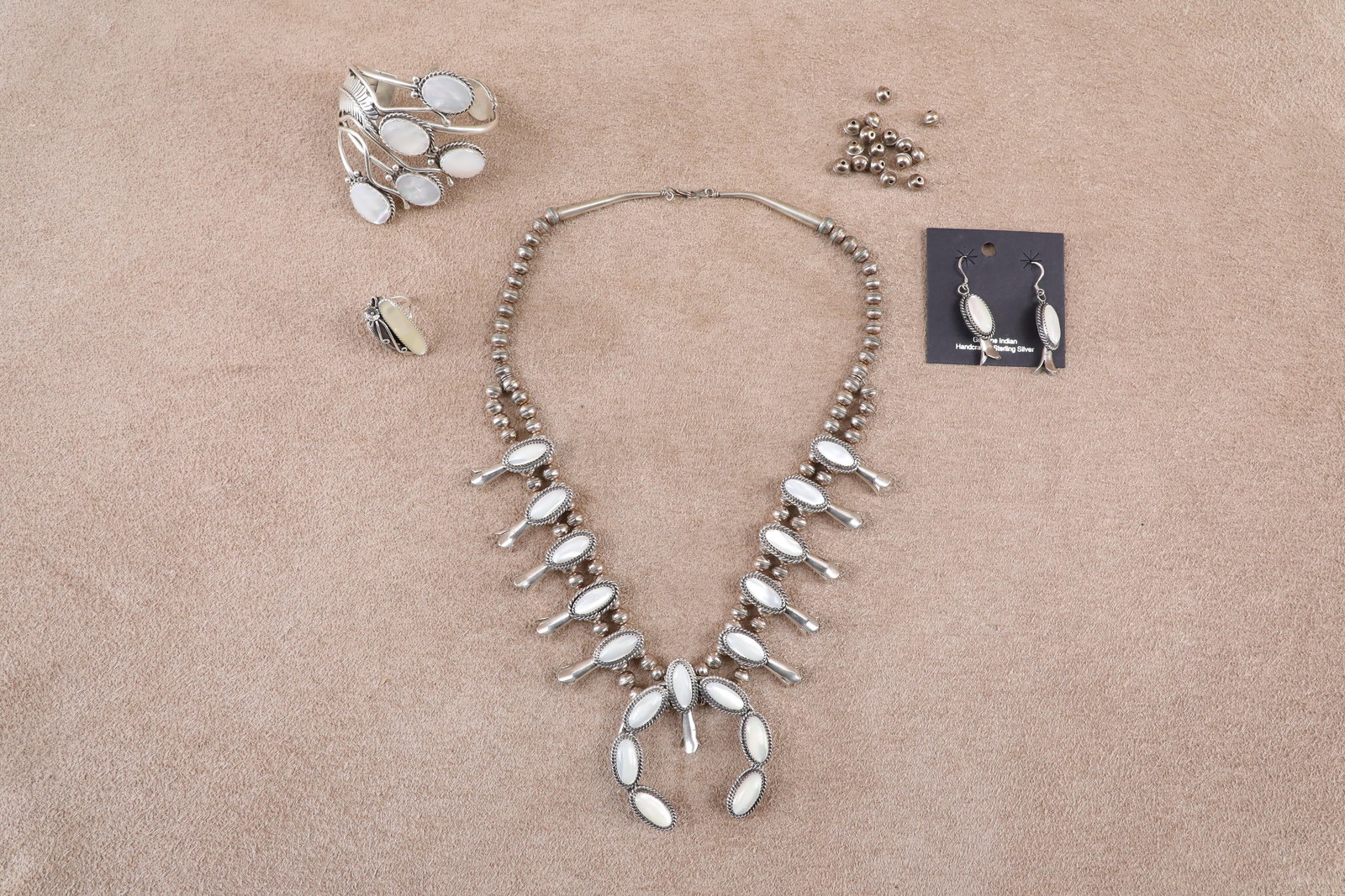 Vintage Lot Southwest Sterling Silver & Mother of Pearl Jewelry: Necklace, Bracelet, Ring, Earrings: In-House Shipping: $12.50 + 1.5% Shipping Insurance Very Good Condition. Some light scattered cleaning and patina. All 4 pieces are crafted of sterling silver with genuine mother of pear