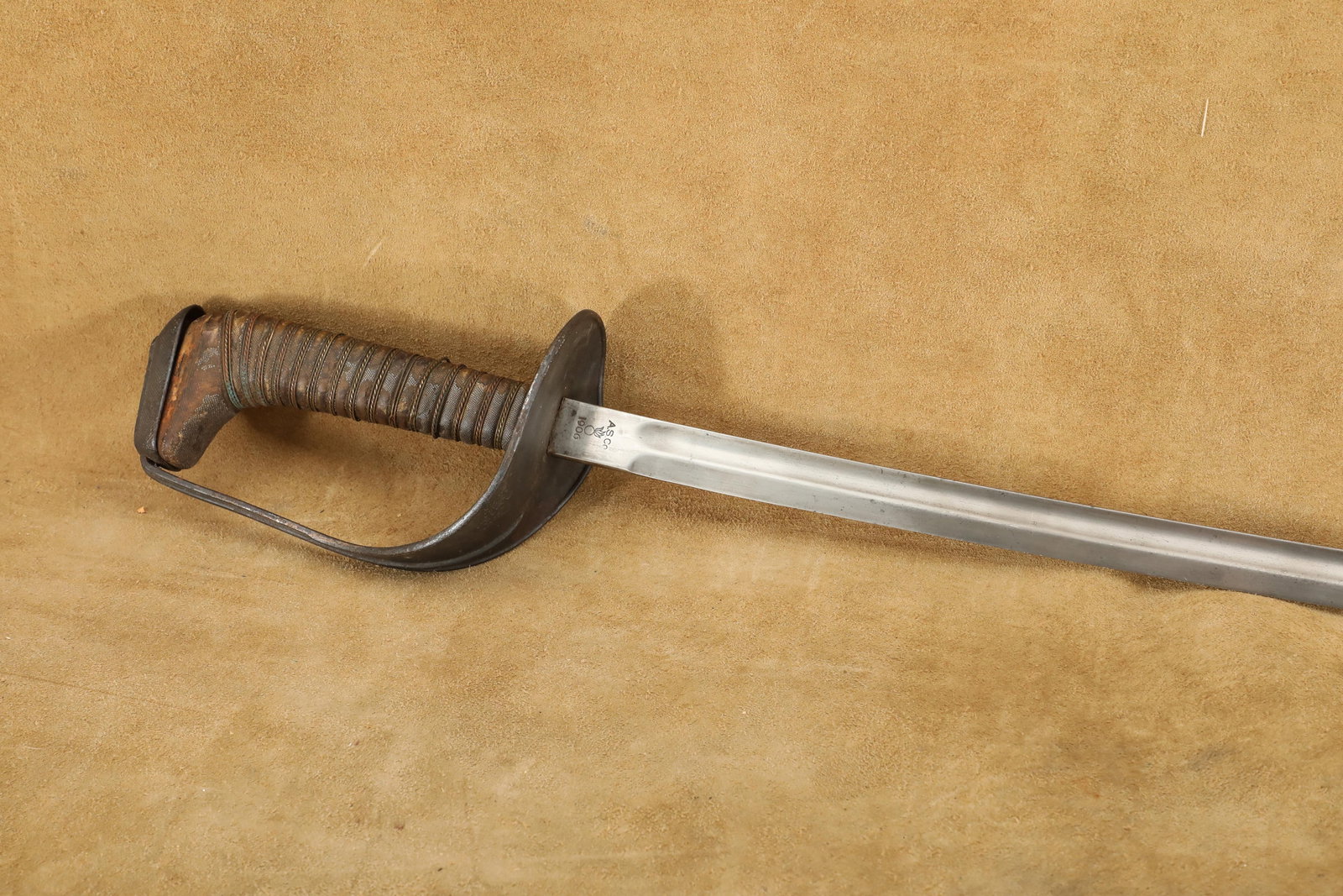 US Army Pre-WW1 Ames Sword Co. Experimental M-1905/06 Cavalry Saber: Fair Condition. Some cleaning, scratching, and pitting to the blade. Some loosening and tearing to a few middle strands of the brass wire handle wrapping. Some smoothing to the sharkskin grip. Some pa