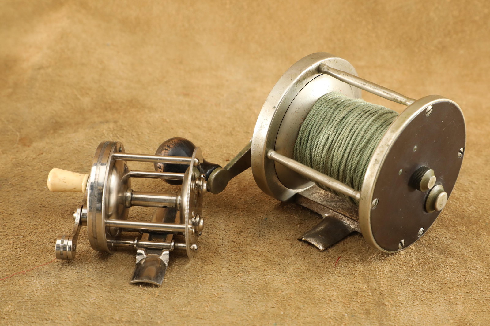 Lot of 2 Vintage 1930s Winchester Fishing Reels, 1 3/8" Model 2236, & Rare Model 2647: Good to Very Good Condition. No chipping or loosening to the handles. Some scratching and spot patina to the Model 2647. Fully functional bait clickers on both, and with the Model 2236 also featuring