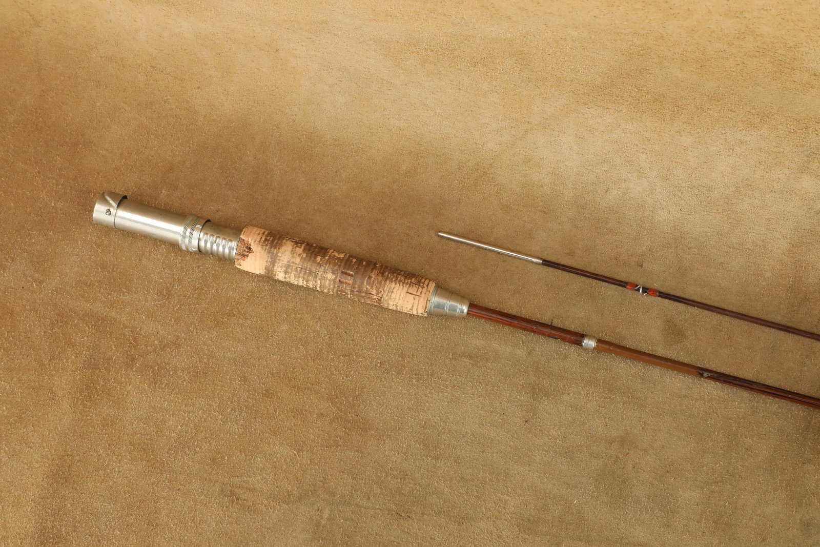 Antique 1920s Winchester Model "Best" 5100 7' 2 Piece Takedown Steel Fly Fishing Rod: Good to Very Good Condition. Some minor paint chipping at the ferrule, as well as chipped cork in the grip. All 7 line guides and reel seat are present and in working condition. This rod is made of 2