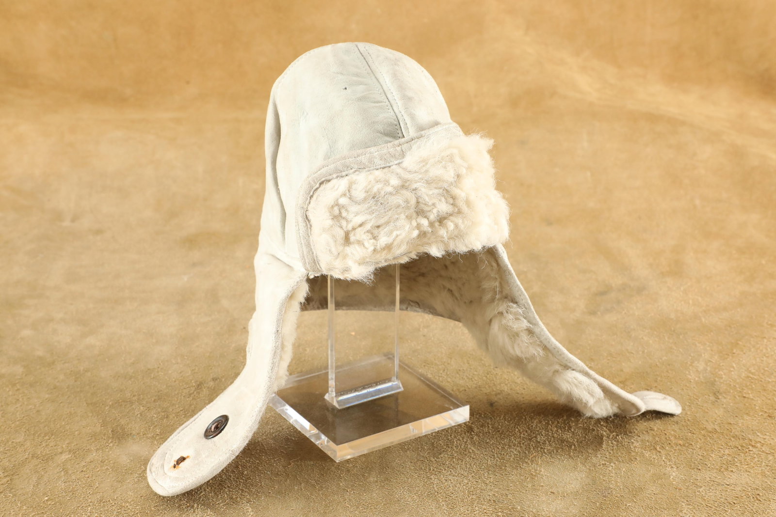 German WW2 Luftwaffe Pilot Eastern Front "In The White" Sheepskin Leather Flight Cap 1942 Dated: In-House Shipping: $12.50 + 1.5% Shipping Insurance Very Good Condition. Missing the bottom button from the right ear flap. Crafted of soft "in the white" sheepskin leather with a warm s