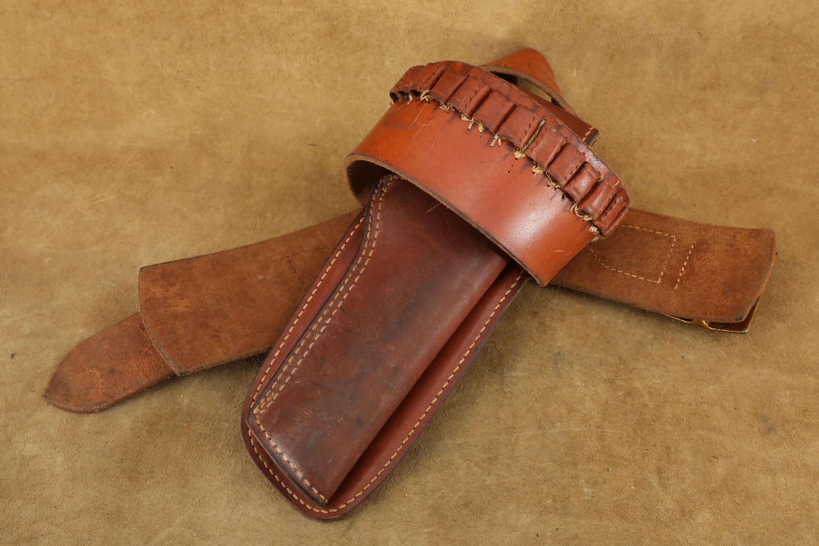 Vintage 1950s "Property Of Republic Studios" Hunter Colt 4.75" .22 SAA Movie Prop Holster & Belt Rig: Good Condition. All of the shell loops on the belt have torn away and been re-stitched at some point in the past, with the back right 4 loops never re-stitched. Both the holster and belt are stamped a