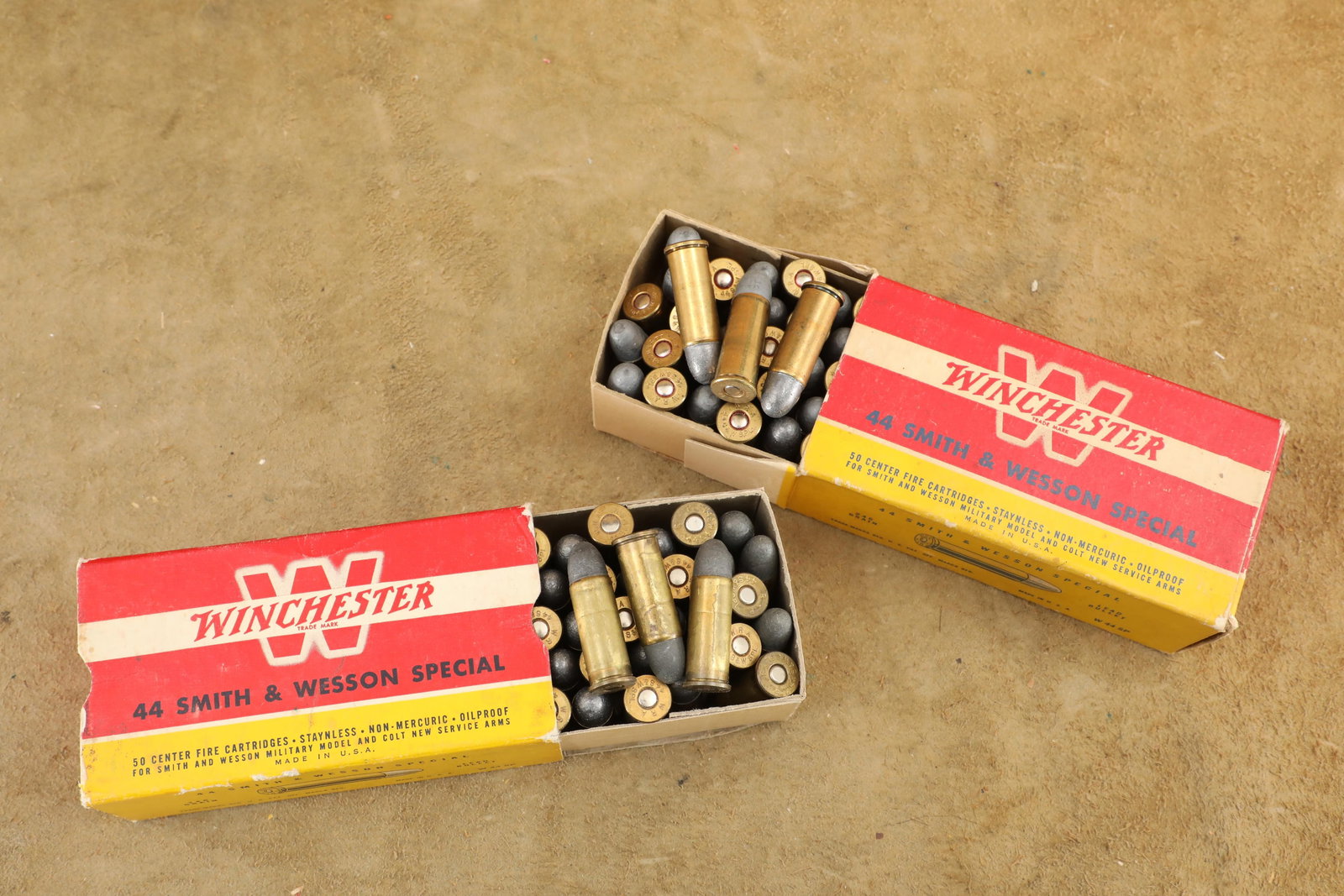 2 Full Correct Boxes, 100 Rounds of Vintage 1950s Winchester .44 Smith & Wesson Special Ammo: Good Condition. An old price of "5.90" hand marked in black on one box. Some scattered spot darkening and edge scuffing to both of the classic white outline "W" boxes. 246 grain lead bullet.