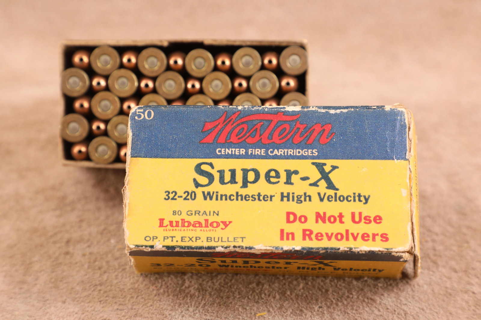 Full Correct Box, 50 Rounds of Vintage 1950s Western Super-X .32-20 Winchester Ammo: Good Condition. End flaps are separated but present. Special callout "Do Not Use In Revolvers". 80 grain open point expanding. Saran wrapped for preservation.