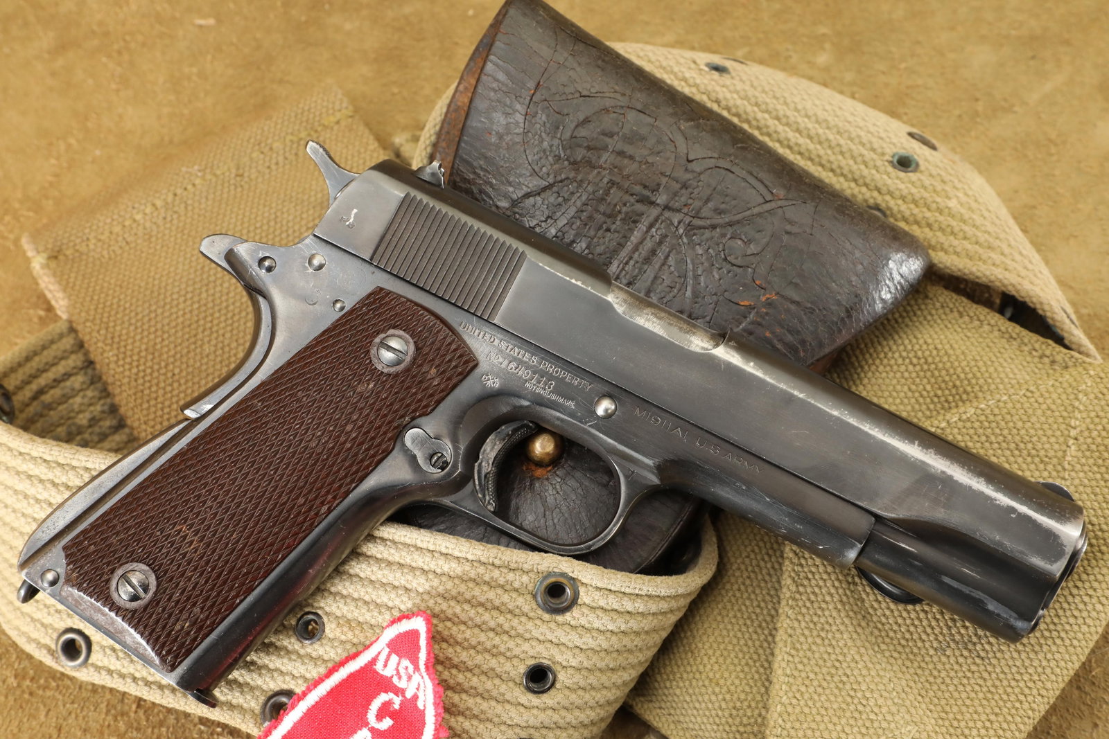 Inscribed British Proofed WWII Colt M1911A1 .45 ACP Semi Auto Pistol and Rig, 1944 C&R: Make: Colt Model: M1911A1 Serial Number: 1649113 Year of Manufacture: 1944 Caliber: .45 ACP Action Type: Single Action Semi-Auto with Removable Mag