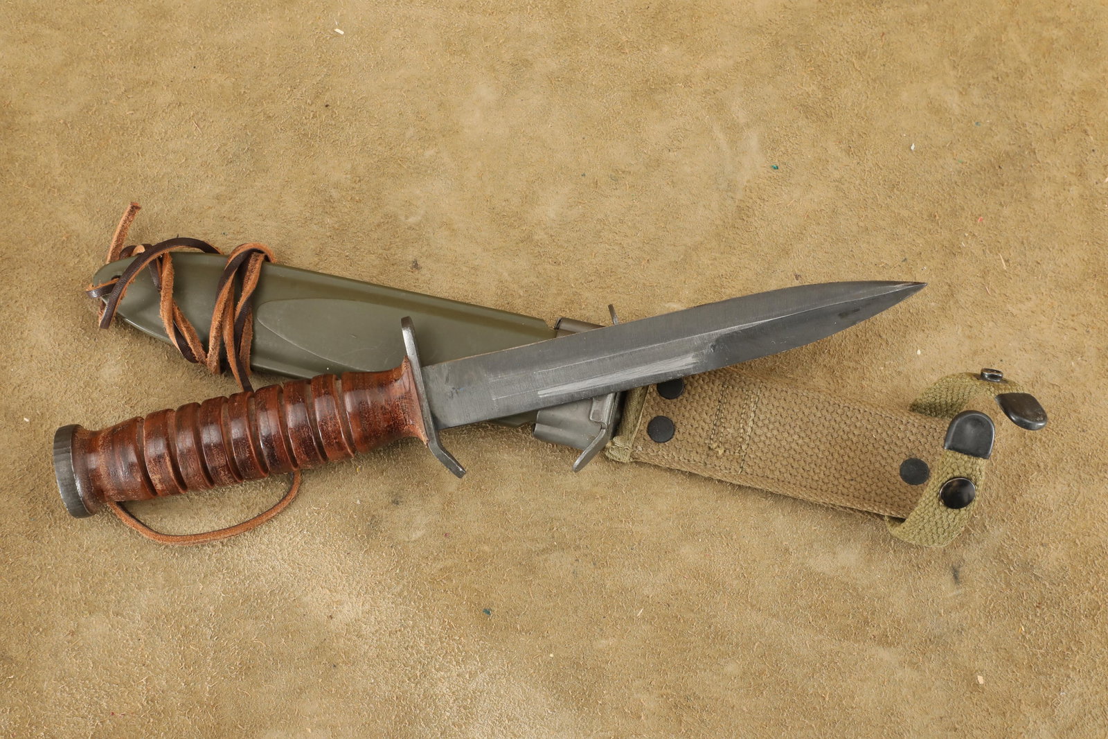 US Army WW2 D-Day Paratrooper Airborne Utica Blade Marked M-3 Trench Knife, 1st Pattern M-8 Sheath: Excellent Condition. Some light sharpening to the blade edge. Some light scuffing to the blade tip. Some scabbard wear/finish abrading at the middle left side of the blade. Features a 6 3/4" spearpoin
